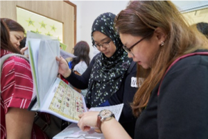 Participants perusing the centre's weekly menu Participants perusing the centre's weekly menu