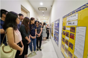 Participants reading posters Participants reading posters